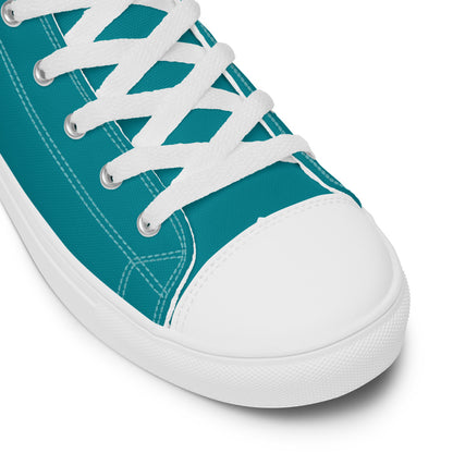 A close up of the toe of the teal Discovering the Gate teal high top shoe.